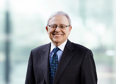 Joe Braccio on light blue and white bokeh banner