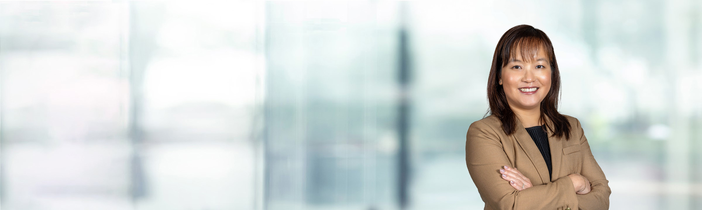 Stephanie Lau on light blue and white bokeh banner